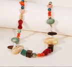 Colorful beaded necklace on a white background