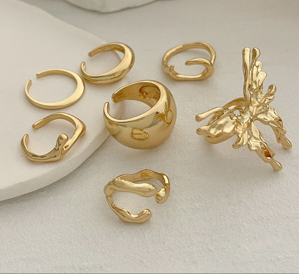 Set of gold rings on a light background