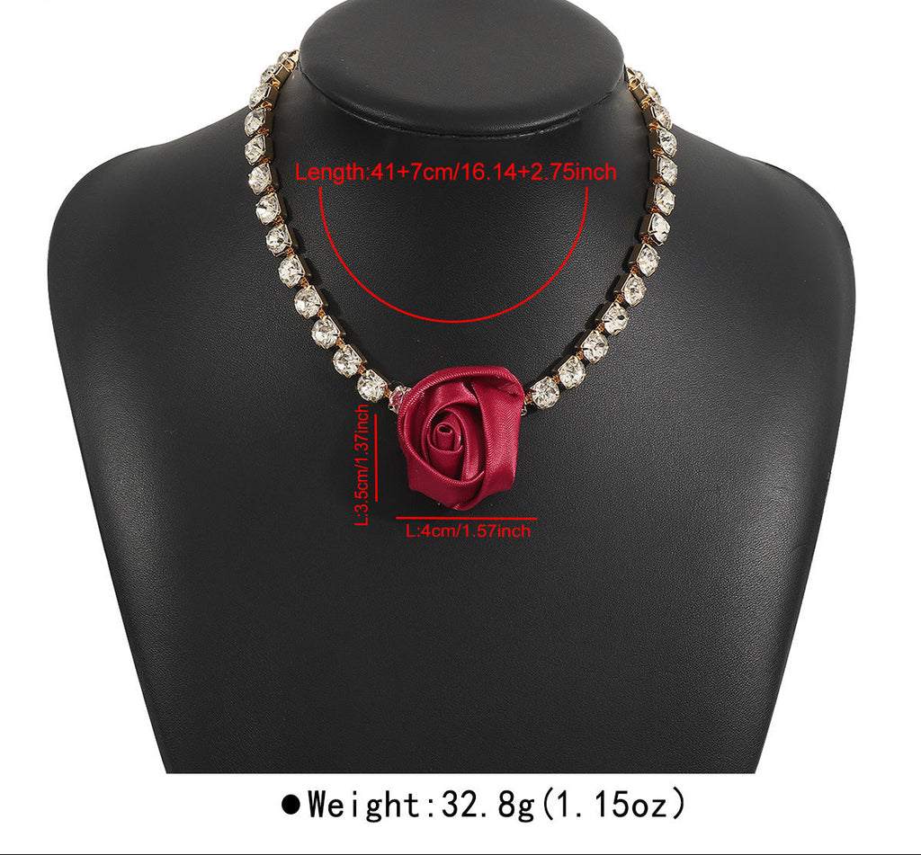 Necklace with a red rose pendant on a black mannequin bust, showing measurements and weight.