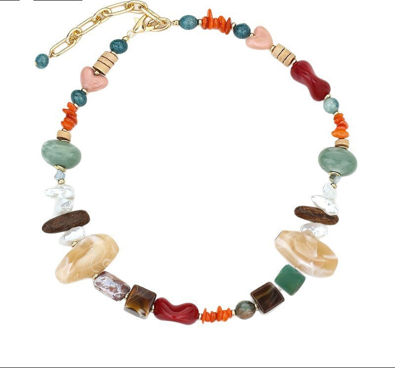 Colorful beaded necklace with a gold clasp on a white background
