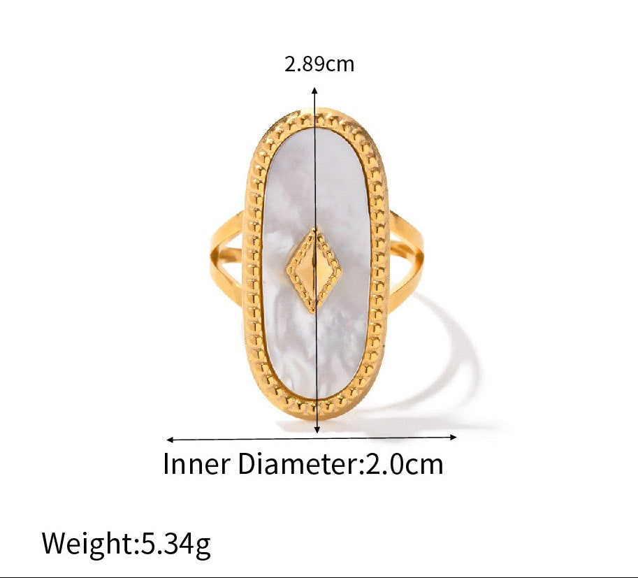 Gold ring with a white stone, showing measurements and weight on a white background.