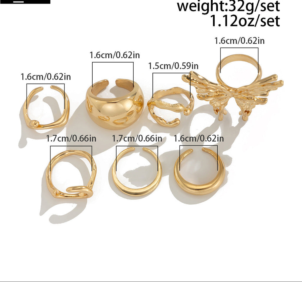 Set of gold rings with measurements and weight details on a white background